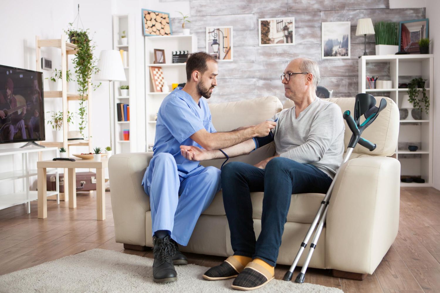 Caregiver helping senior walk